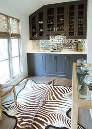 They automatically make a room look bigger, and they're relatively easy to clean. Mirrored Subway Tile Backsplash Contemporary Kitchen Benjamin Moore Cheating Heart