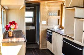 Next, to the cabinet, you find a couple of shelves with additional items. Our Top 5 Tiny House Storage Solutions For Maximizing Space
