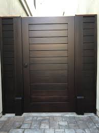Modern designs have a certain exterior style that's easy to identify. Custom Contemporary Wood Gate With Matching Panels By Garden Passages Wood Gate Contemporary Gates Fence Gate Design