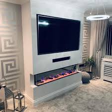 The fireplace was installed (by the fireplace manufacturers) in a basic wood frame that our contractor put up ahead of time. How This Living Room Was Transformed With A Media Wall Featuring The Ezee Glow Celestial Built In Electric Fire