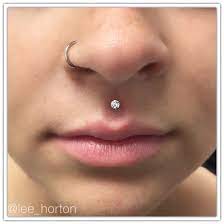 Philthrum Piercing With Neometal Swavorski Crystal Legacy Tattoo Piercing London Ontario Face Piercings Philtrum Piercing Facial Piercings
