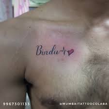 Name With Heart Tattoo Mumbaitattoocolaba Bigguystattoo Tattoo Nametattoo Chesttattoo Co Name With Heart Tattoo Heart Beat Tattoo Collar Bone Tattoo