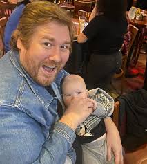 Two men and a baby!!! There's a baby bottle in my hand just fyi! Folks  thought we were a gay couple who adopted a kid so we got treated extra nice!