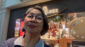 Happily watching gondolas pass by and listening to the Italian Boatmen  serenade their boat riders. With Cardo Dalisay at The Venetian Hotel and  Casino, Las Vegas, Nevada