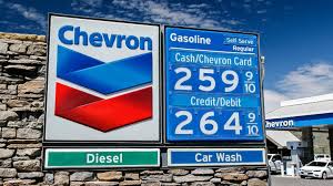 A white circle with a black border surrounding a chevron pointing up. Is Chevron With Techron Gas Really Better For Your Car Wpxi