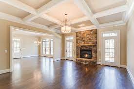 Exposed beams, a plaster fireplace, and wrought iron door frames create a mediterranean vibe in this newport, california home. Stone Fireplace Flanked By French Doors Traditional Living Room Other By Otey Construction Inc Houzz