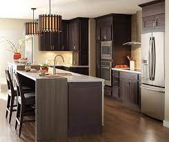 Islet kitchen or kitchen island can be seen as an ideal transition between the living room and kitchenette. Dark Finish Modern Kitchen Cabinets Kemper Cabinets