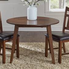 A round table is very well suited to a formal style dining rooms as well as a more open floor plan where the dining area is off to the side in a larger room. Aamerica Mason Round Drop Leaf Dining Table Novello Home Furnishings Dining Tables