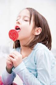 Little Girl Enjoying The Sugar Lollipop Stock Photo, Picture and Royalty  Free Image. Image 37040381.