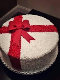 A White Cake With A Red Ribbon Christmas Cake Designs Christmas Cake Christmas Cakes Easy