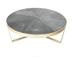 Stunning pie shaped coffee table featuring a low profile design and a strong wooden build. Antica Collection
