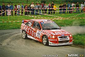 It's a rally where the racing line is several feet off the road, with a wheel and an apex in the ditch. Final Results Belgium Ypres Westhoek Rally 1998