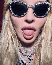 65-year-old Madonna "burns" the network, posing topples next to a  mysterious man