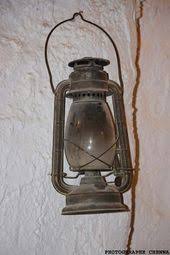 رحبة الصور صورة قنديل زيتي معلق بجدار غرفة الشهيد السي الحواس Wall Lights Light Home Decor