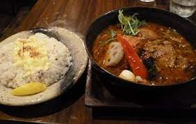 Customers first choose their soup curry type (chicken leg, seafood, vegetable, mushroom, etc), then their soup (house original or a speciality stock for a few hundred yen extra). Soup Curry Garaku