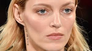 Stella McCartney autumn/winter 2019 Paris Fashion Week send sa sustainable  fashion message through tattooed slogans