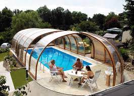 It's simple touch deployment, the touch of a button makes it the perfect choice for your swimming pool. High Or Low Pool Screen Enclosures Which One Should You Go For Excelite Plas Retractable Pool Cover Indoor Pool Pool Enclosures