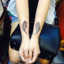 Angel wings tattoo on side. 30 Awesome Wings Tattoos On Arm