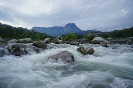 It consists of the states of sabah and sarawak on the northern part of the island of borneo and is separated from mainland peninsular, or west, malaysia on the malay peninsula by some 400 miles (640 km) of the. Beautiful View River With Mount Kinabalu The Highest Peak In Stock Photo Picture And Royalty Free Image Image 81275537