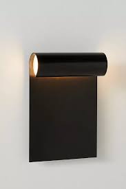 A flattened candlestick that has a handle. Lighting Decorative Unique Lighting Anthropologie In 2021 Outdoor Sconces Modern Outdoor Sconces Outdoor Sconce Lighting