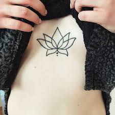 Blossomed lotus flower tattoo below chest. 40 Beautiful Lotus Flower Tattoos
