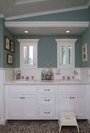 You could go deep with nautical navy or with a light and delicate sea glass green on your walls. Beach House Living Room Decor Coastal Style Paint Colors Bathroom Colors Beach Theme Bathroom Bathroom Design