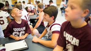 Bullitt students find role models in football players