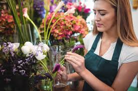 Maybe you would like to learn more about one of these? Female Florist Arranging Flowers At Her Flower Shop Garden Center Care Stock Photo 227257966
