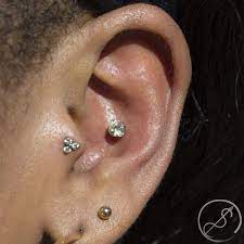 Fresh Tragus And Conch Piercings By Christina Featuring Champagne Czs In Jewelry By Neocultists Christina Is Going To Be The O Conch Piercing Piercings Tragus