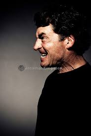 Profile Of Intense Man Expressing Strong Emotions with Dark Background in  Studio