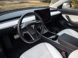 I personally love wood decoration, it will look more natural. The Tesla Model 3 Reviewed Finally Ars Technica