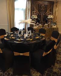 Birthday Black And White Table Setting 60th Birthday Color Round Black Table With Black Chairs Decorated With A White Ostrich Feather Cente 60th Birthday Party 60th Birthday 70th Birthday Parties