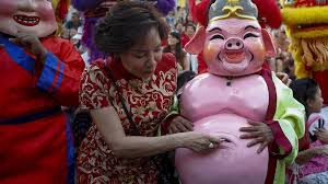 Fireworks, special clothes, red lanterns and lots of food will mark the occasion. In Pictures Lunar New Year Welcomes The Year Of The Pig Bbc News