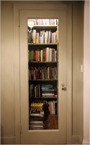 Hall closet + shelves + overhead light + glass door = perfect tiny home library. 9 Creative Book Storage Hacks For Small Apartments