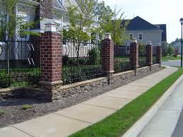 When wrought iron is exposed to the elements, though, it gets dirty fast. Brick Stacked Stone And Wrought Iron Patterned Fence With Light Caps Idf Pensign