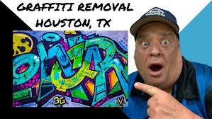 Removing Graffiti With a Pressure Washer from Brick Wall