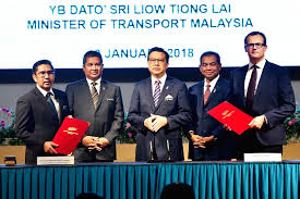 The minister is supported by deputy minister of transport which is hasbi habibollah; Malaysia Putrajaya Mh370 Search Operations Signing Ceremony