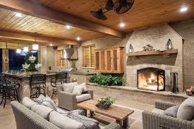 It's the ultimate in backyard entertaining—an outdoor fireplace where friends and family gather to share good times and delicious food cooked over an open flame! Rustic Mississippi Pool House Landscaping Network