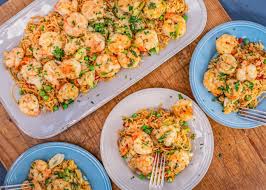 Myrecipes has 70,000+ tested recipes and videos to help you be a better cook. Rachael S Spanish Shrimp Scampi Pimento Rice With Peas Rachael Ray