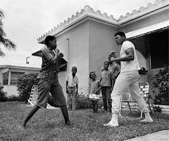 Clay has just won the title and is talking to malcolm about converting to islam. Cassius Clay Muhammad Ali Miami 1964 Charles Trainor