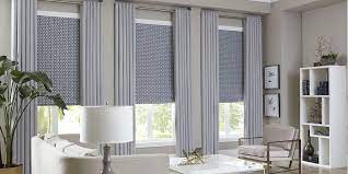Hang the blackout shades behind the wood blinds much in the same way that the original blinds were hung. How To Layer Window Treatments The Blinds Com Blog