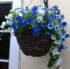 Now buying the fake flowers might be somewhat of an investment but these will not only look awesome all summer but you can take them in, clean them up and store for next summer. Artificial Hanging Baskets The Artificial Flowers Company Artificial Hanging Baskets Artificial Plant Wall Hanging Flower Baskets