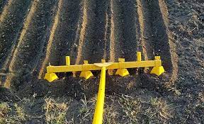 Just pull the tool through cultivated soil and the steel spades will do the work for you. The Rowmaker Is An Amazing Tool That Helps You Make Farm Style Rows In Minutes Watch The Video To See Backyard Farming Garden Tractor Attachments Garden Tools