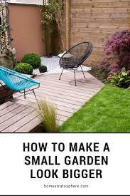 This Small Garden That Is Covered With Bermudagrass And With Different Planters On The Sides Beside The Wooden Wall Has A Sma Small Garden Garden Small Gardens