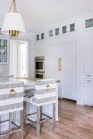 White And Gray Striped Counter Stools Sit In Front Of A Light Gray Kitchen Island Fitted With A Butcher Block And White M Home Kitchen Bar Stools Home Kitchens