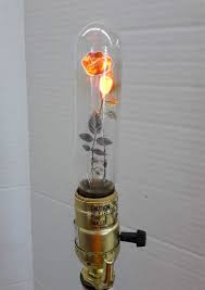 Twisted wire outdoor string lights and bakelite sockets. Beautiful Vintage Light Bulbs Feature Luminous Floral Filaments Vintage Light Bulbs Light Bulb Art Bulb