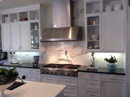Custom cut marble slab backsplash in a beautiful design with white subway tiles. Amazing New Kitchen Backsplash Using Stonepeak Ceramic S Large Porcelain Tile Kitchen Design Porcelain Slab Slab Backsplash