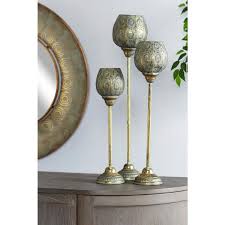 Easily find metal candle holders that fit your style and budget. Litton Lane Tall Decorative Metallic Gold And Patina Pierced Metal Candle Holders Set Of 3 67133 The Home Depot