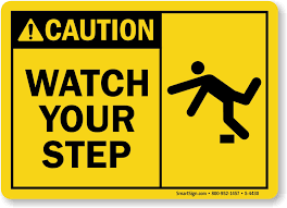 Color image of yellow warning roadsign. Watch Your Step Sign