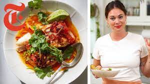 Alison Roman S Tomato Poached Fish With Chile Oil Nyt Cooking Youtube Nyt Cooking Poached Fish Poached Fish Recipes